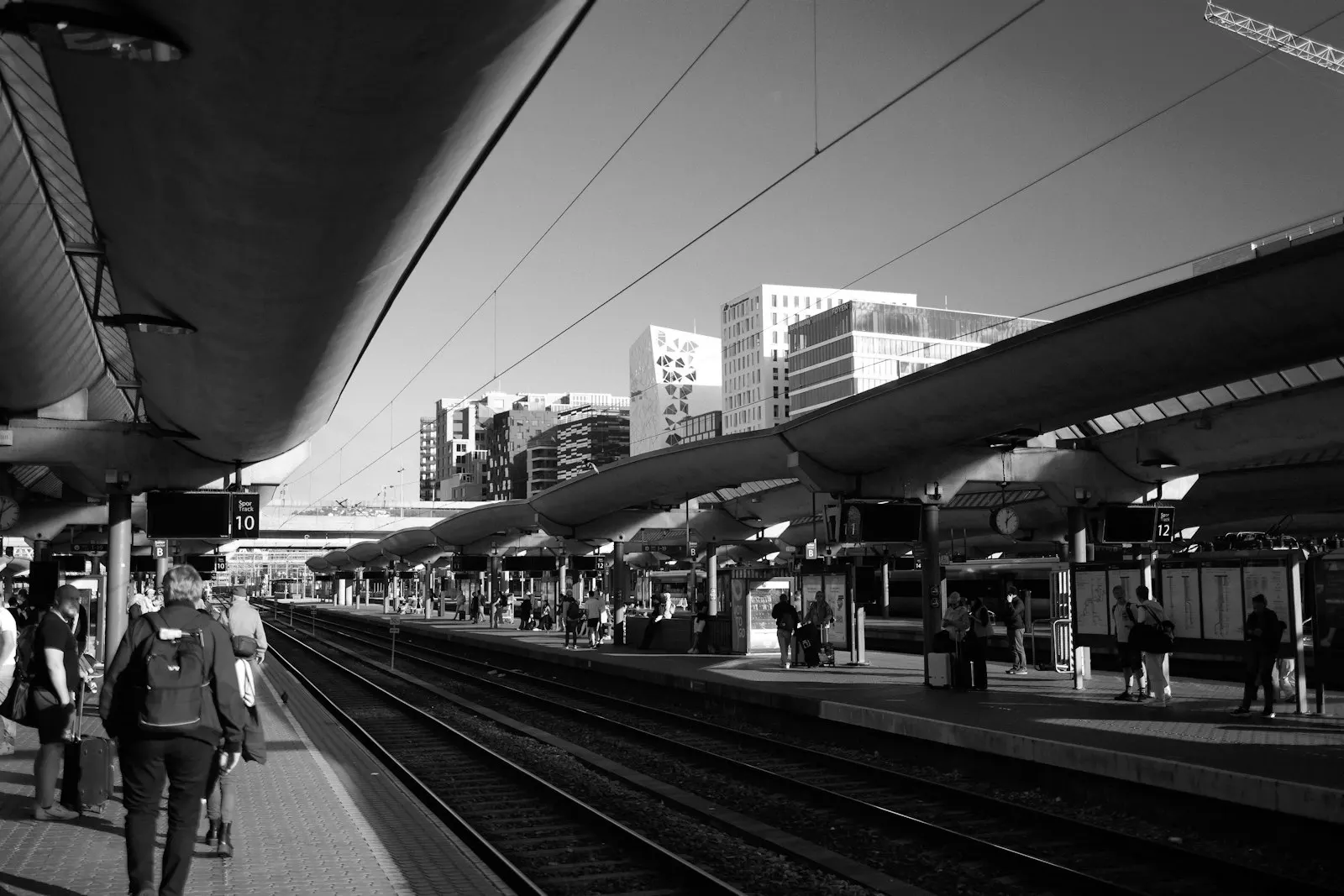 People waiting on a train platform before boarding. Photo by Jordan Ryskamp.