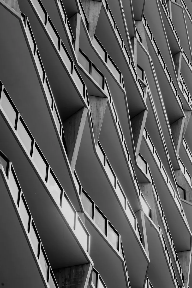 Balconies stacked up the face of a tall building. Photo by Jordan Ryskamp.